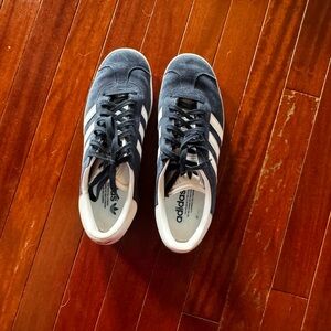 Adidas Originals navy and white gazelles.